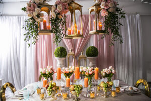 easter table decoration backdrop with lights candles lanterns flowers and easter eggs