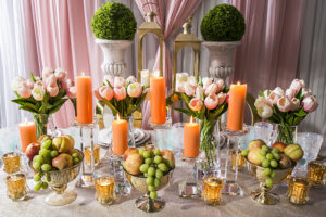 easter table decoration backdrop with lights candles lanterns flowers and easter eggs