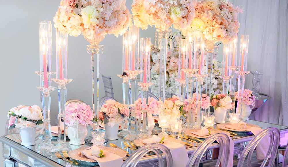 pink and white floral decoration with candles