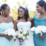 bride and bridesmaids with flowers