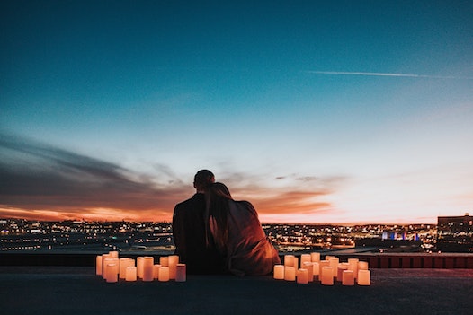 rooftop proposal with city view and candles