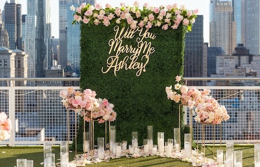 hotel proposal, rooftop proposal with backdrop, floral decor and candles